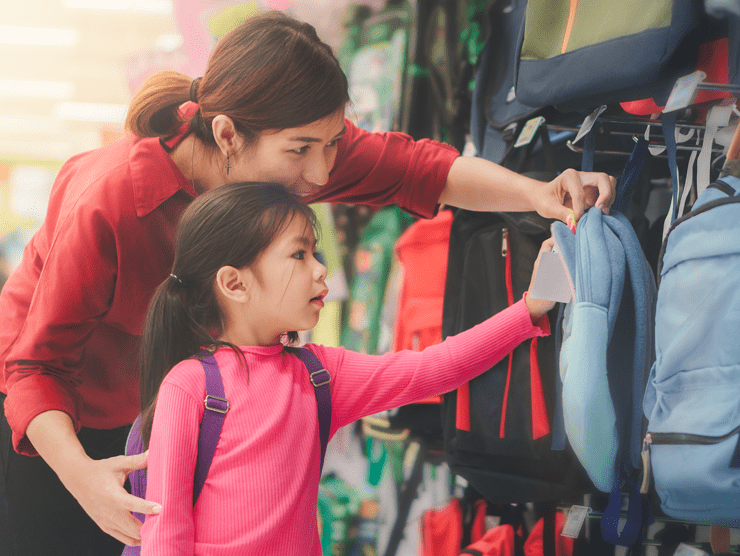 Mother and daughter shopping for backpacks