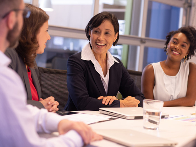 Female leader running a meeting in a conference room
