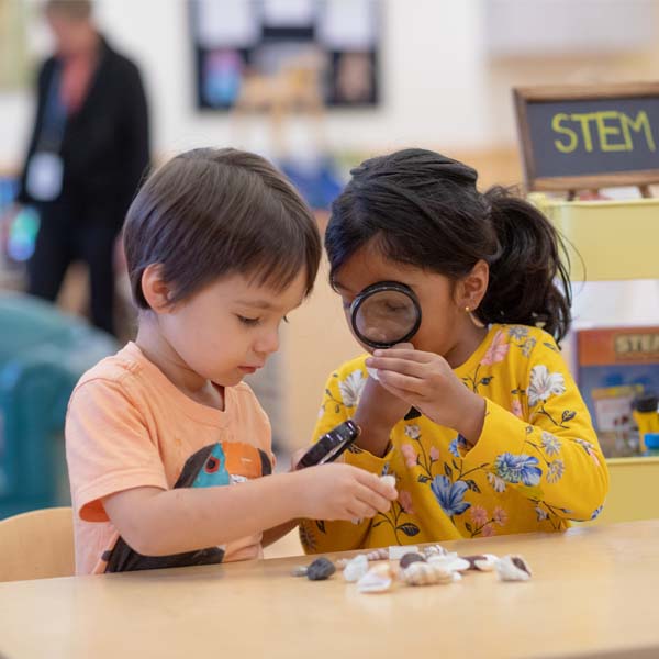 toddlers examining rocks