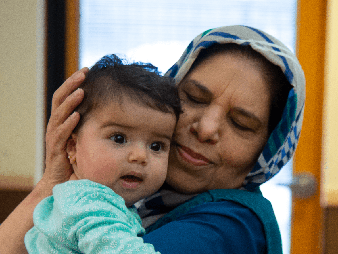 Women refugee holding baby