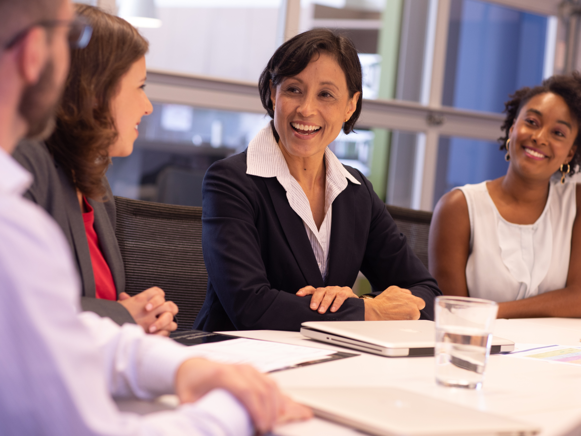Smiling employees in meeting