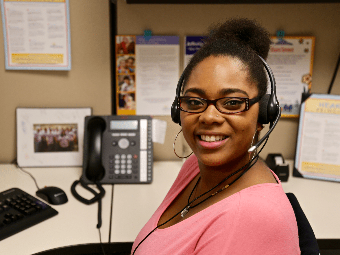 Smiling women of color in office