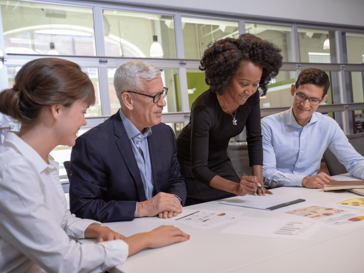 Happy employees working in office