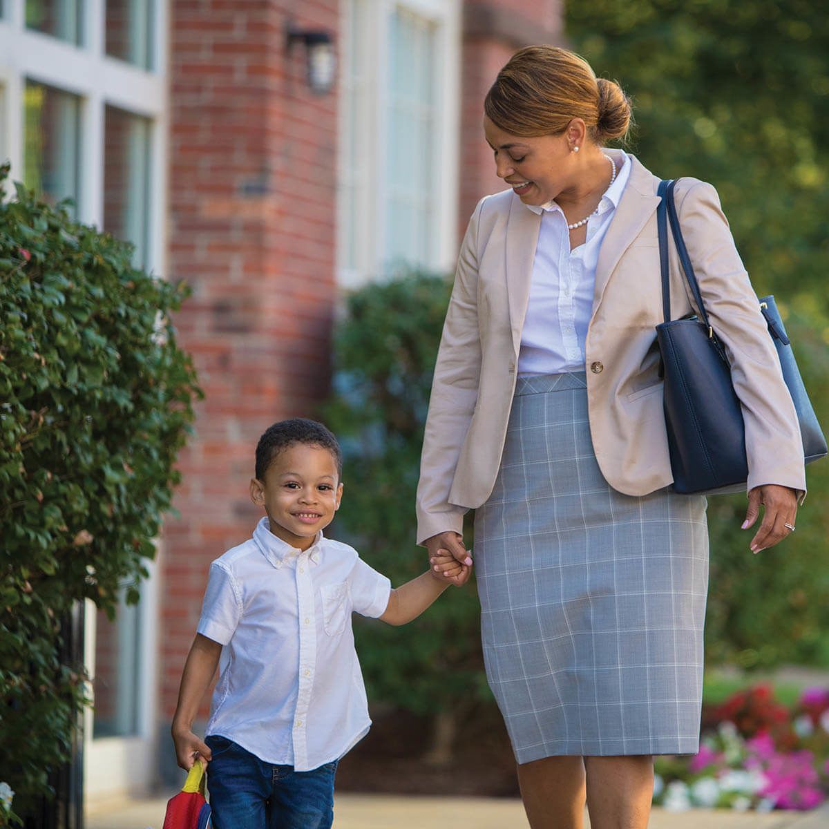 Mom walking outside with preschool son