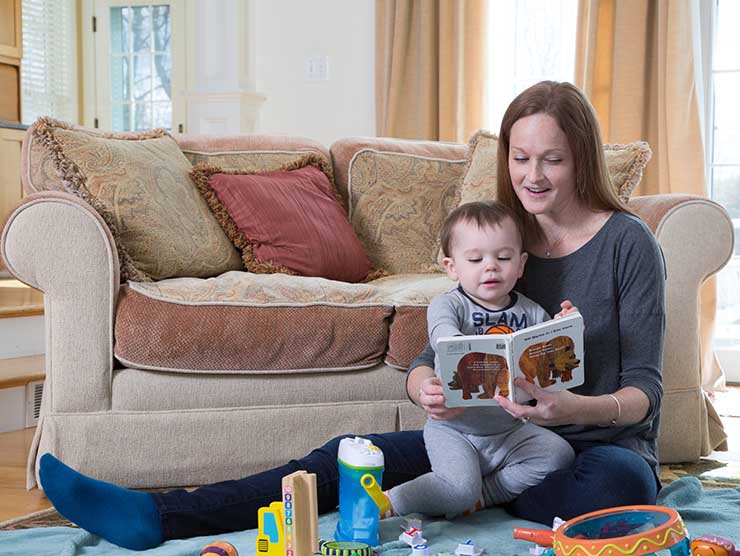 In-home back-up care provider reading to child