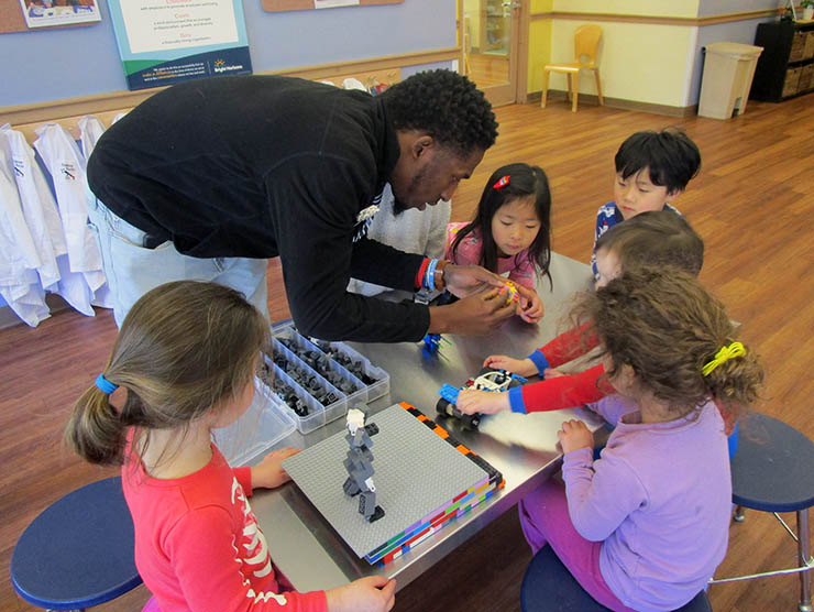 Travis Samuels leading  STEM lesson with LEGOs