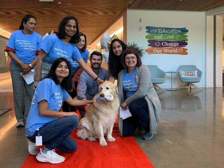 employees and therapy dog 