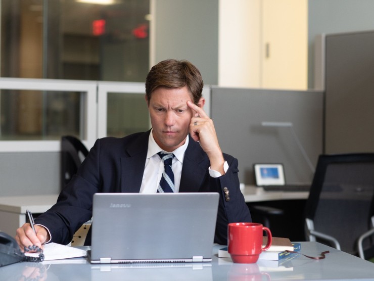 man sitting with laptop