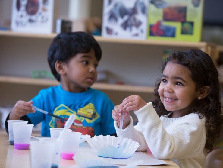 children sitting at table 