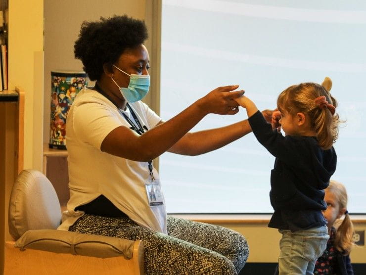 teacher and child dancing 