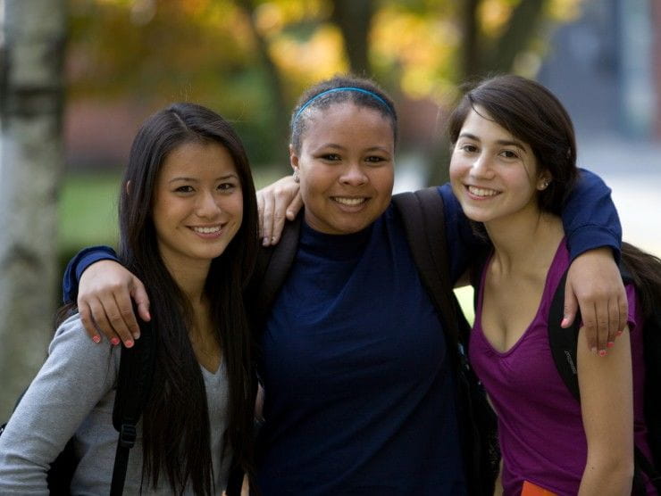 three students standing 