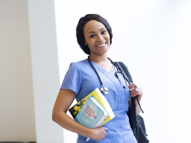 nursing student holding books 