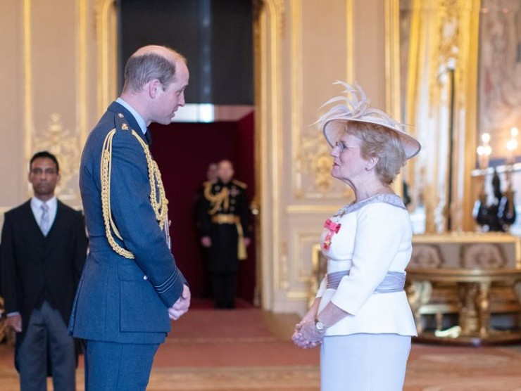 woman standing across from the duke of cambridge 
