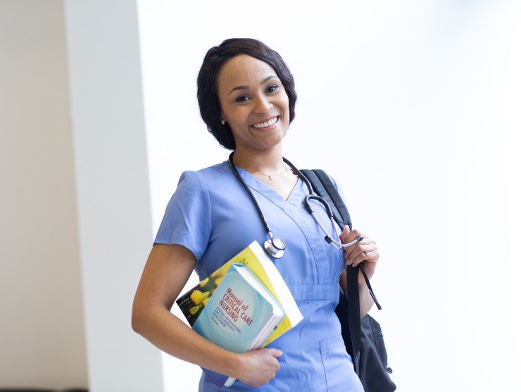 nurse holding books