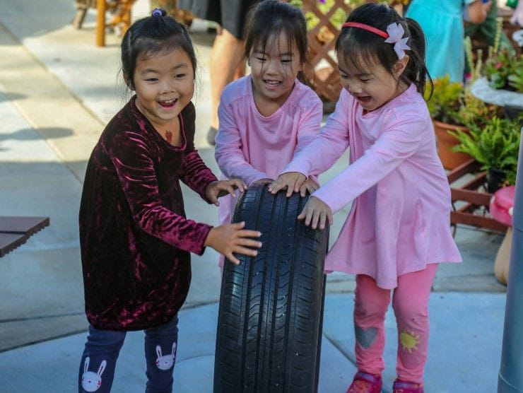 children moving tire 