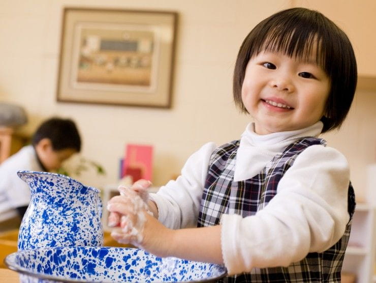 child washing hands 