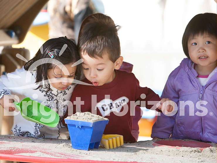 Children playing with sand at Bright Horizons