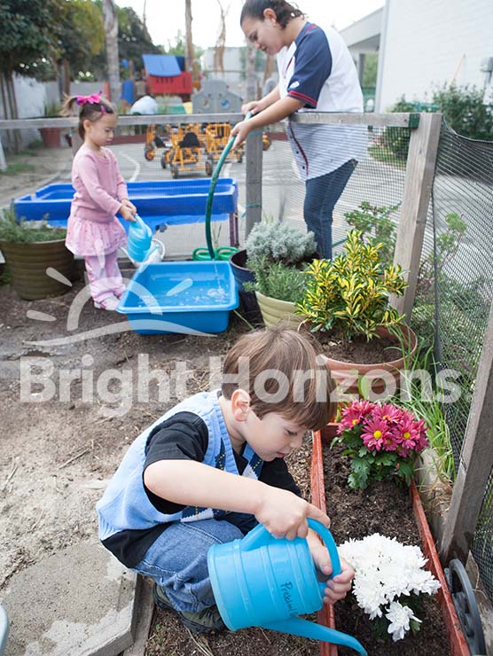 K Prep students watering plants in the garden