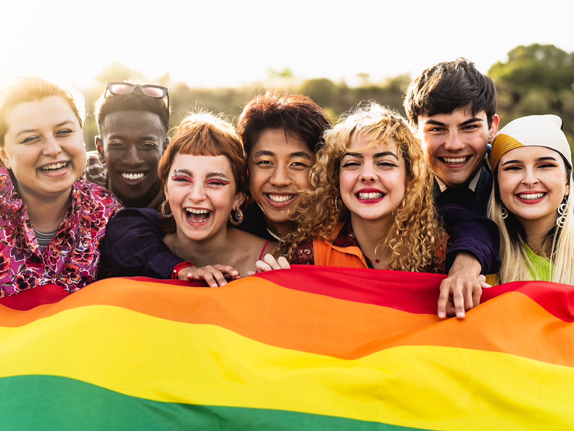 Smiling faces with Pride flag