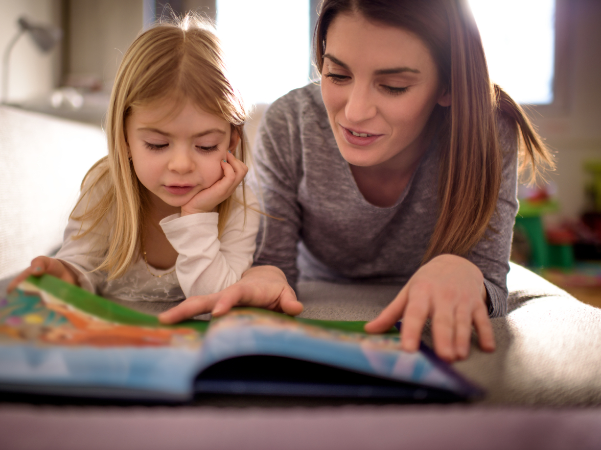 mom reading to her daughter