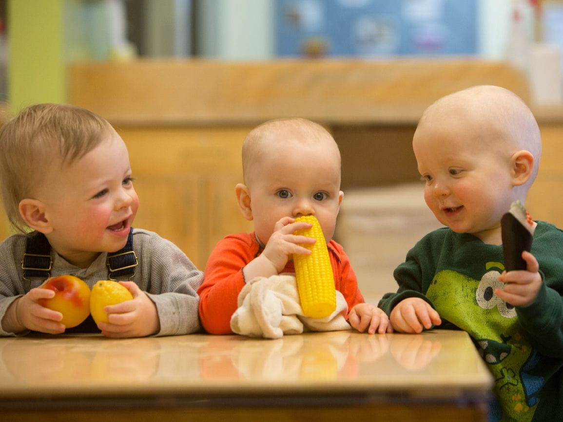 Three toddlers with food