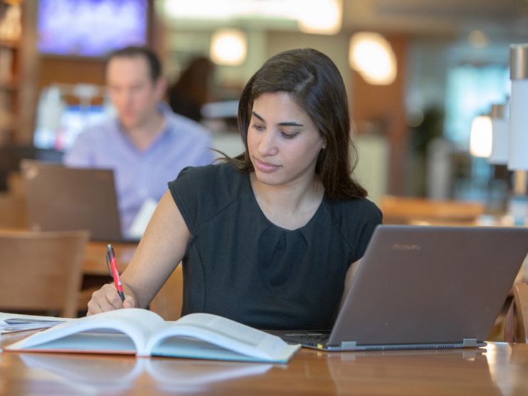 A female college student in a library
