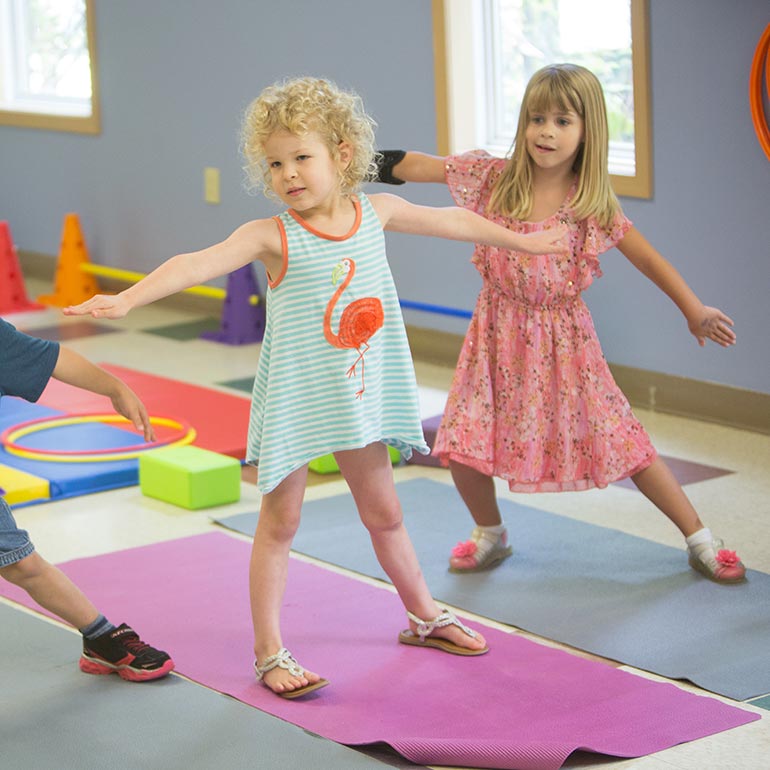 Bright Horizons Preschool Students stretching and yoga