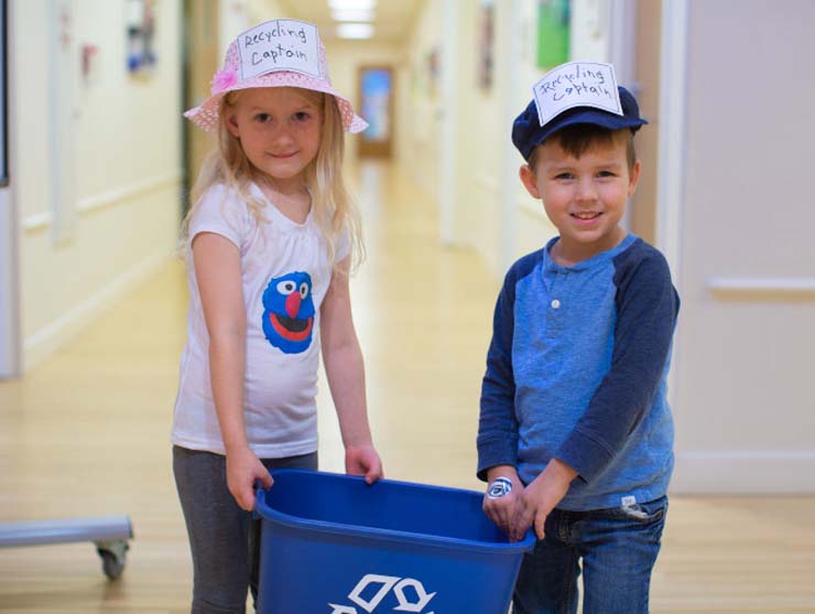preschoolers doing a recycling sustainability activity at Bright Horizons