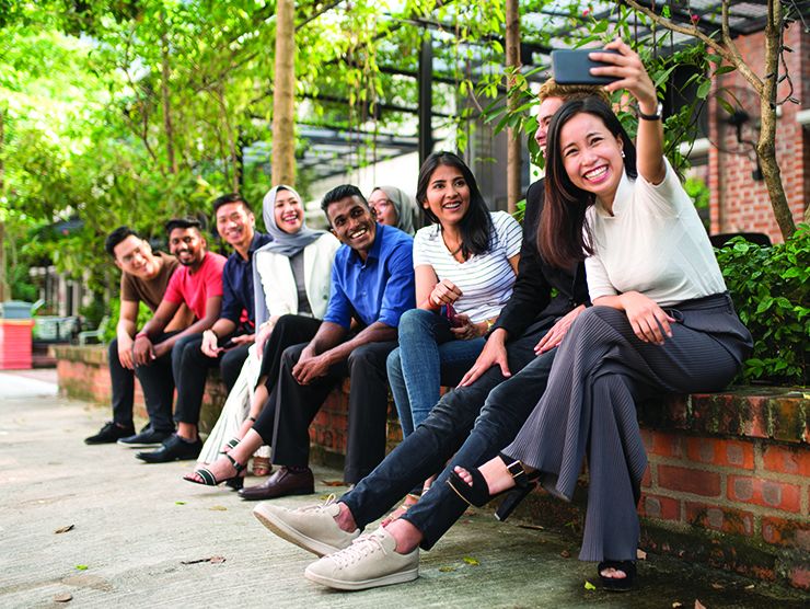 A group of AAPI employees at the office
