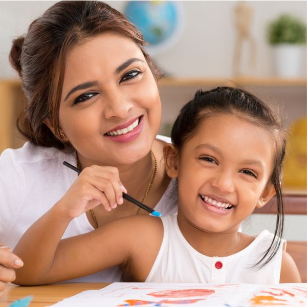 Mother and daughter smiling