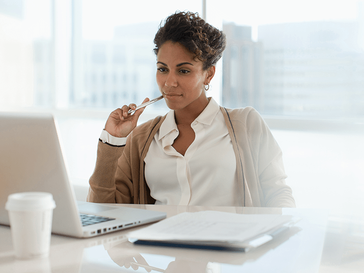 working woman at her office desk laptop