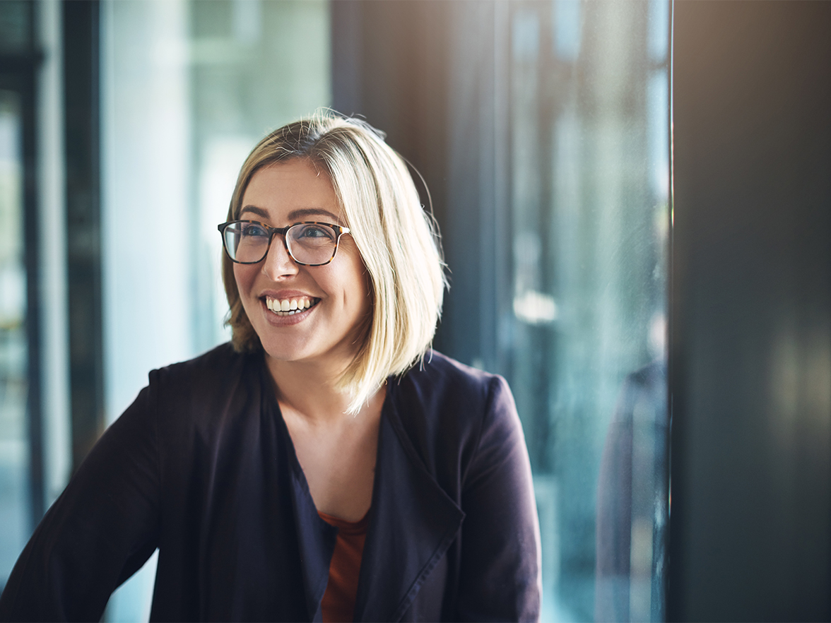 woman smiling at desk