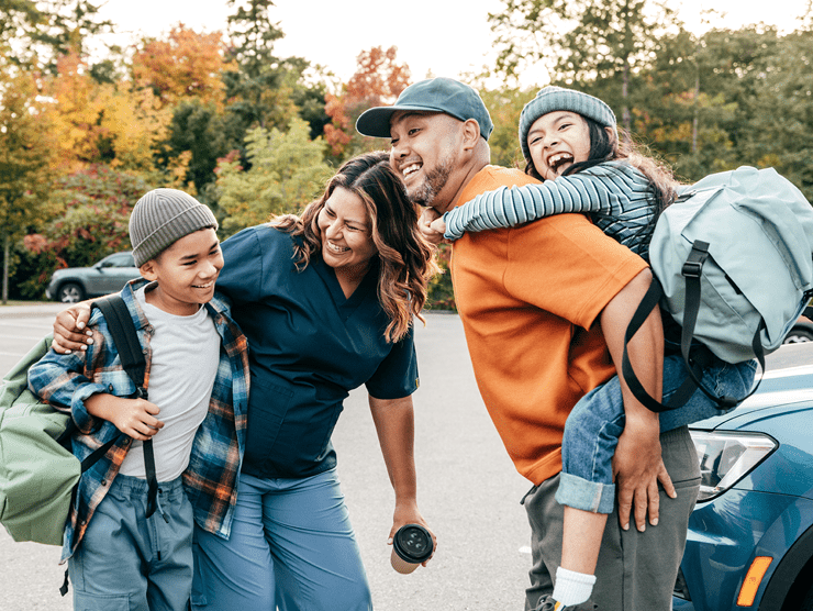 Family standing together laughing