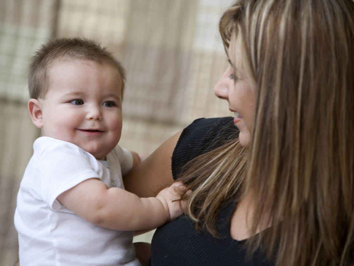A mother holding her infant