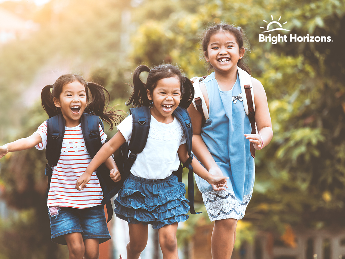 smiling group of girls running happy