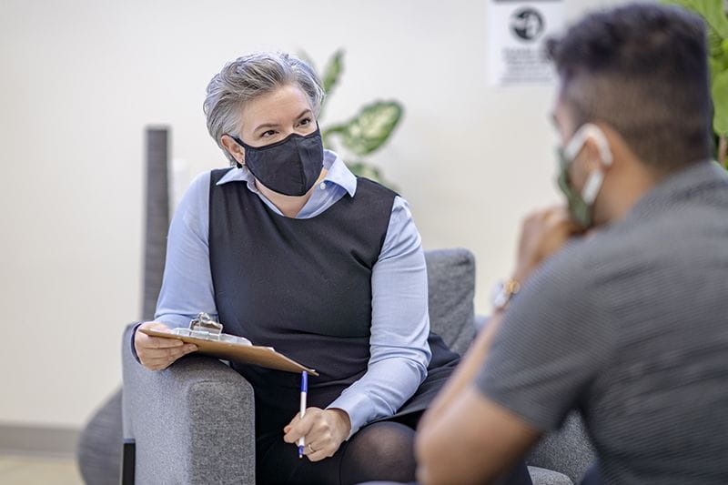 Counselor speaking to a patient
