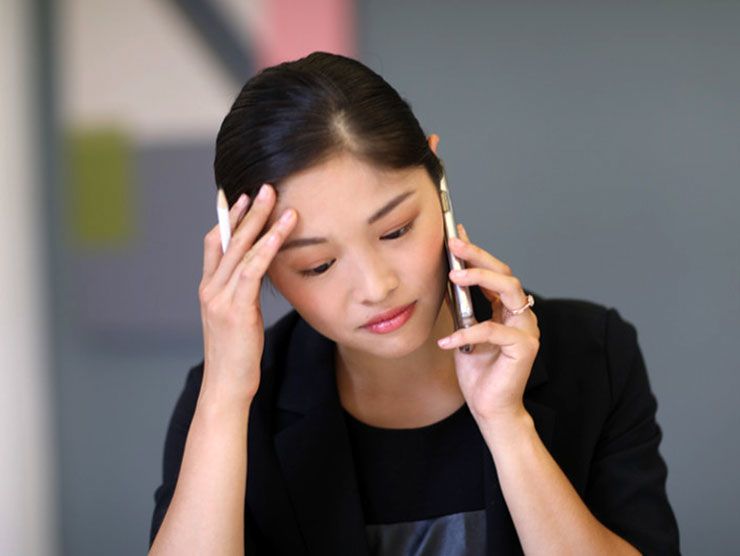 Woman feeling sick and burnt out at work