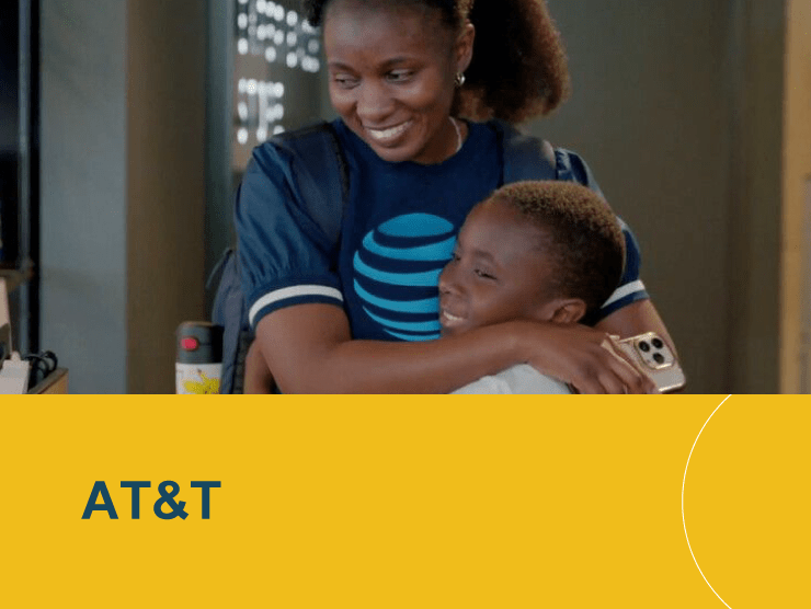 AT&T with mother hugging son and smiling