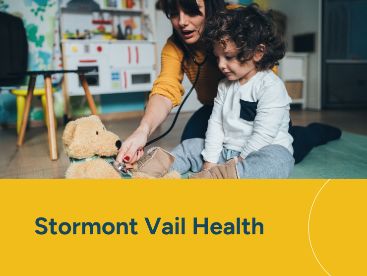 Stormont Vail Health with a young child playing with his caregiver