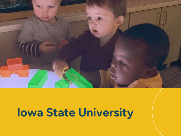 Iowa State University with children at a child care center