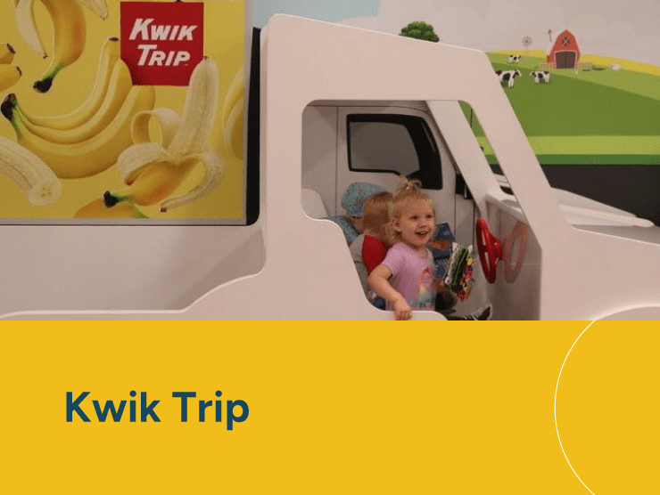 Kwik Trip with children playing in a toy car