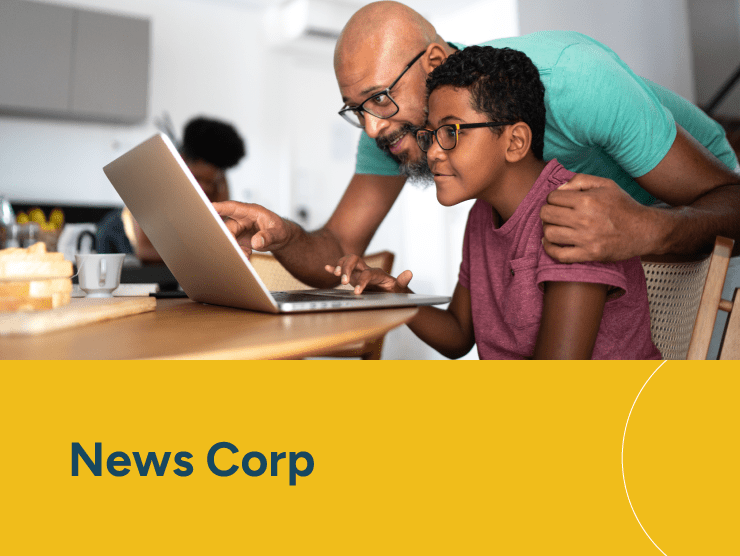 News Corp with a father looking at a computer with son