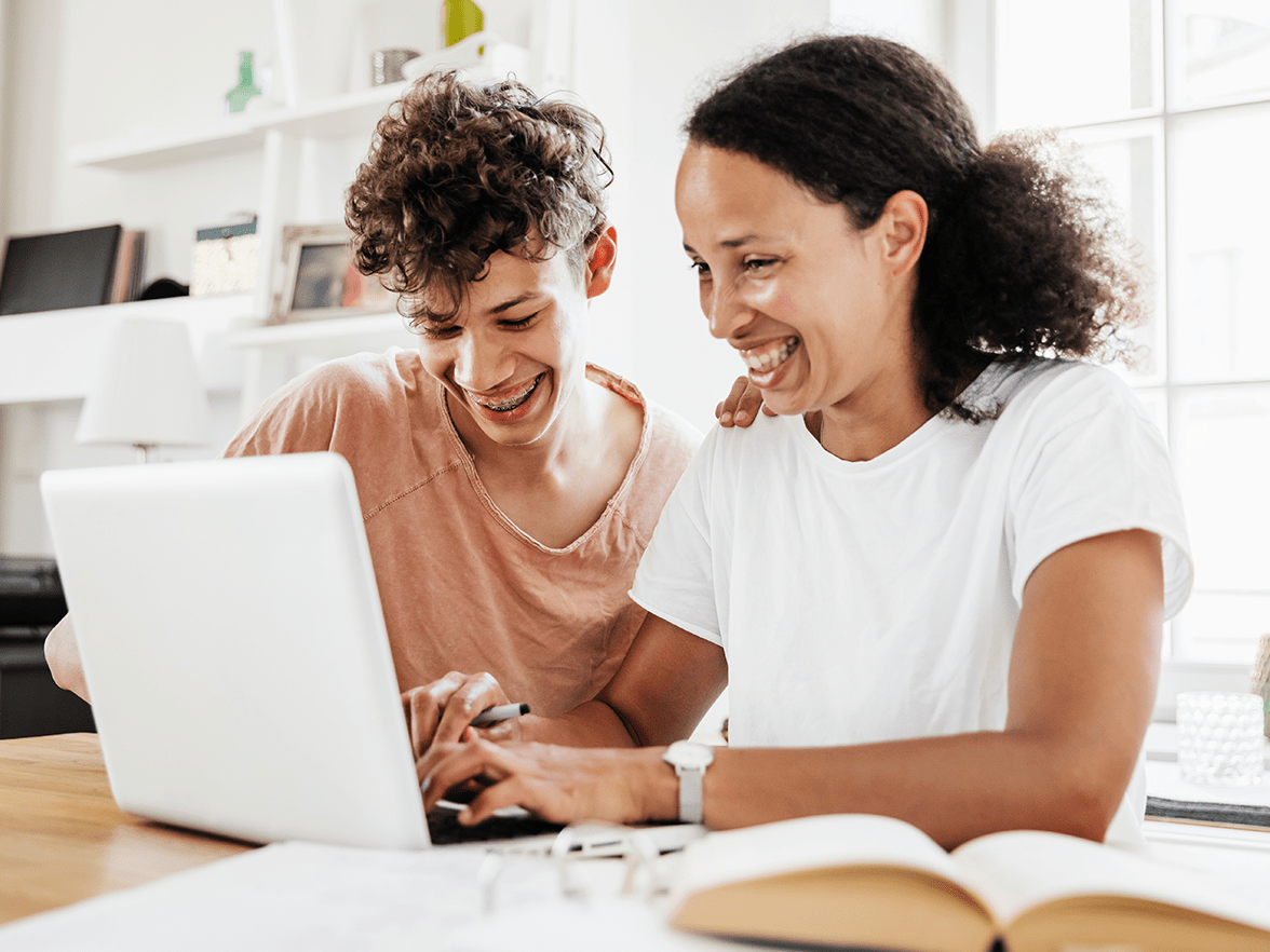 Mother and son looking at a laptop together