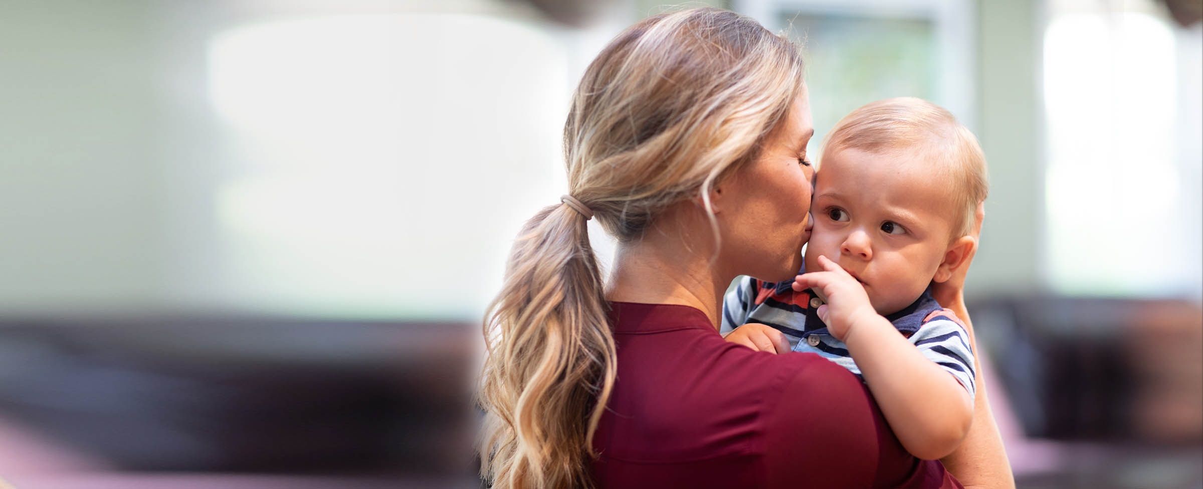 Bright Horizons employee holding her infant