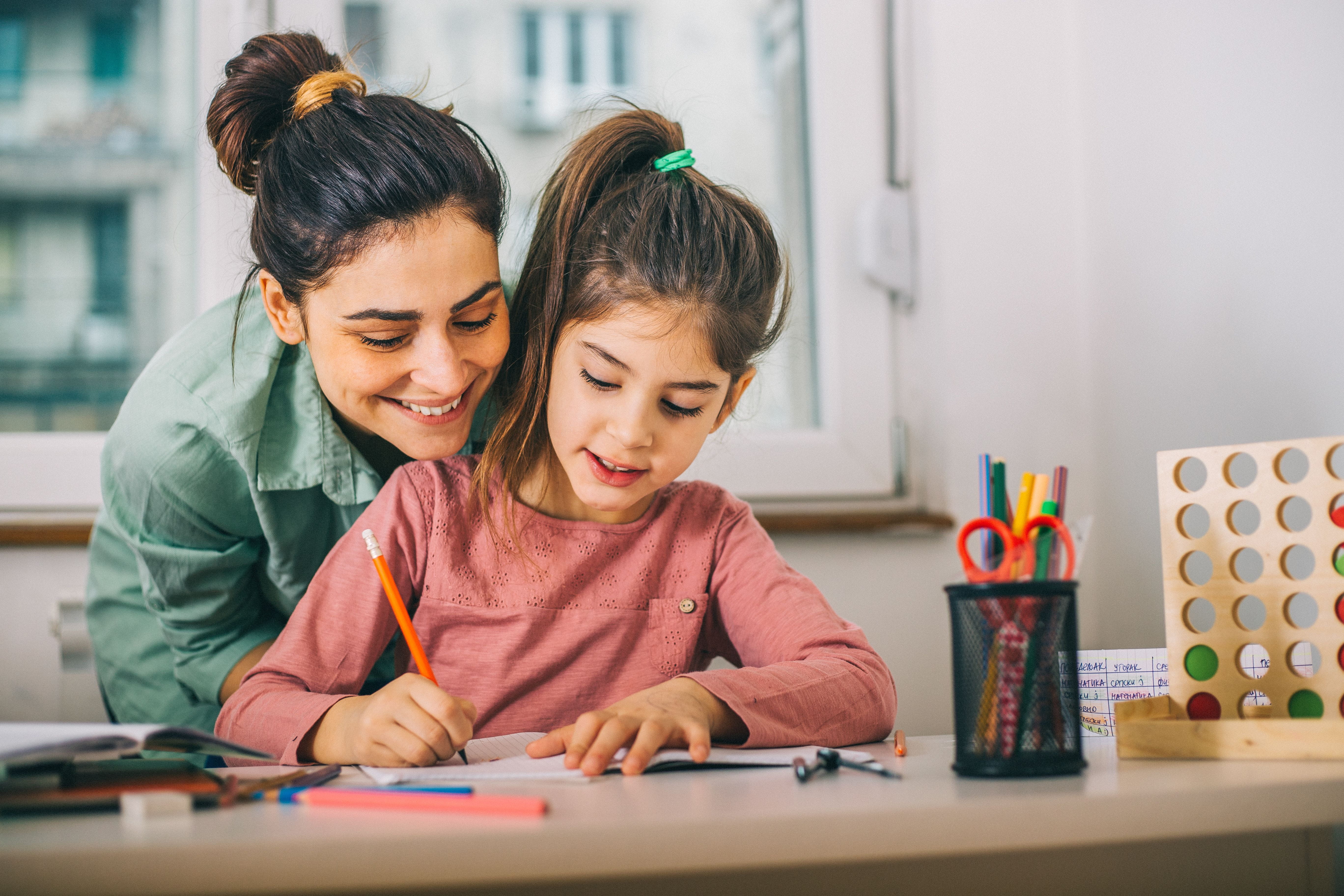 woman and child writing