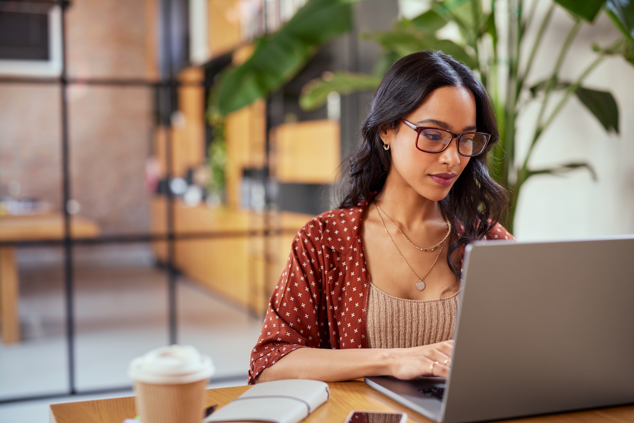 Woman focusing on computer