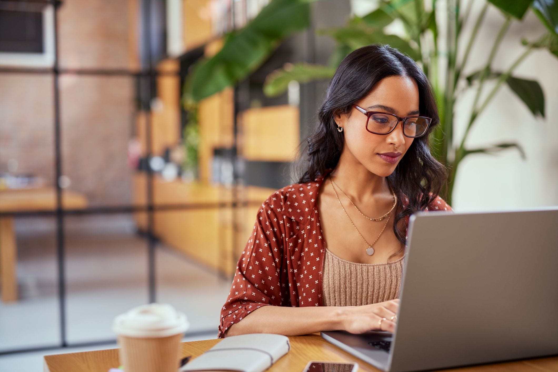 Woman focusing on computer