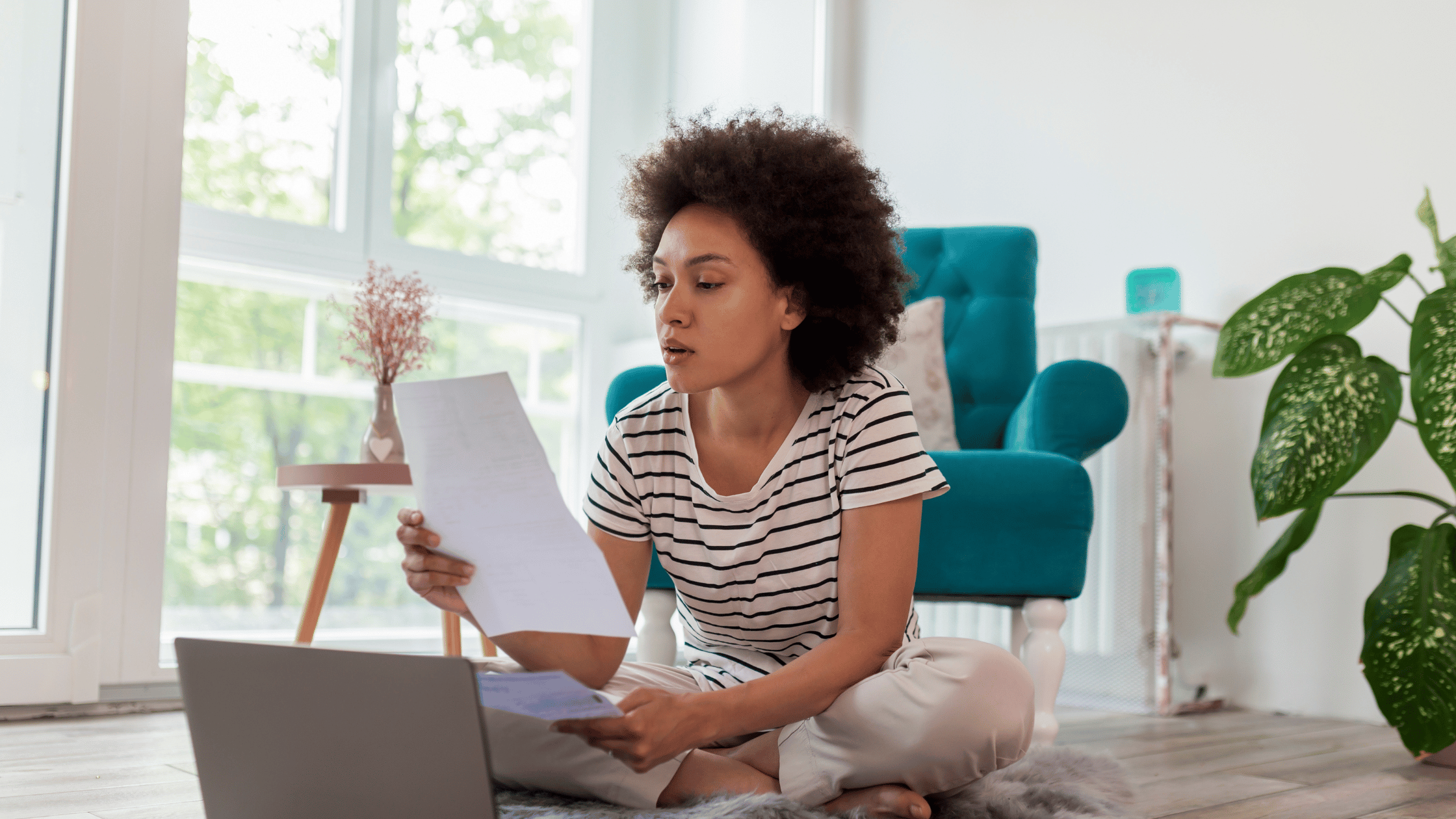 woman paying bills on laptop