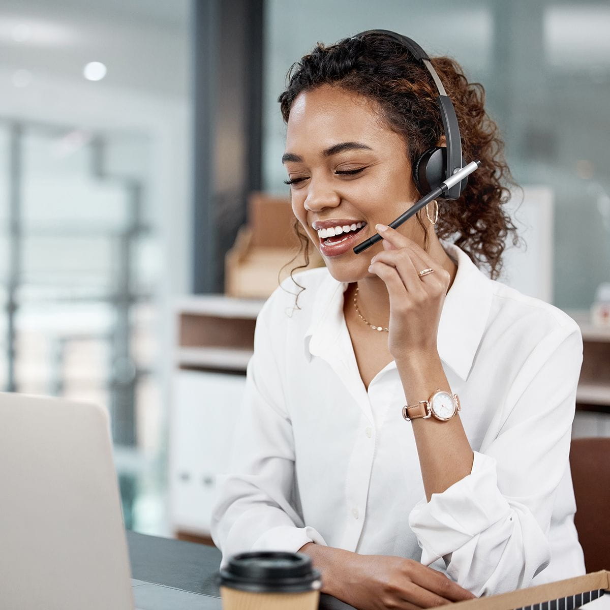 Professional sitting at a desk with a headset