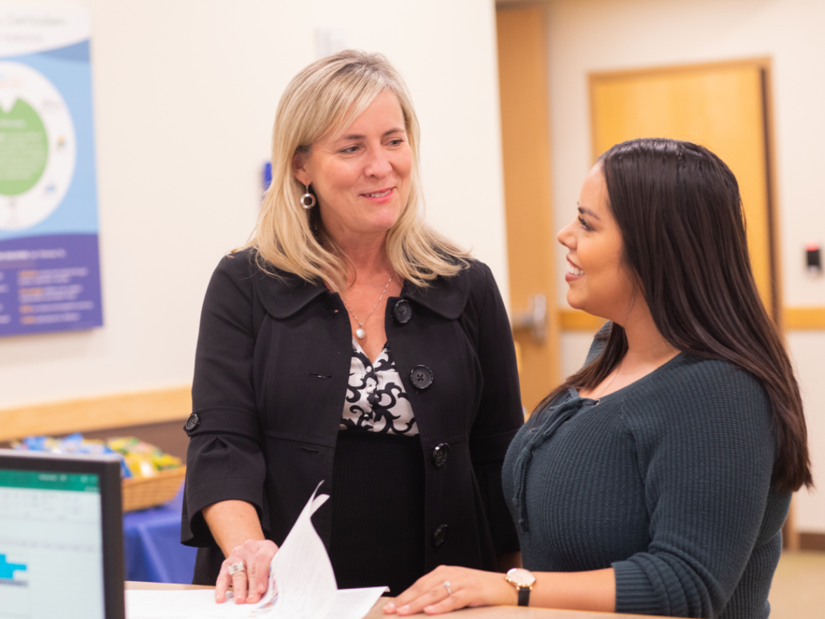 Two women smiling in bright horizons center